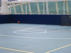 a man standing on a tennis court holding a racquet